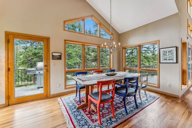 Brightly lit dining room with vaulted ceilings | Image 13