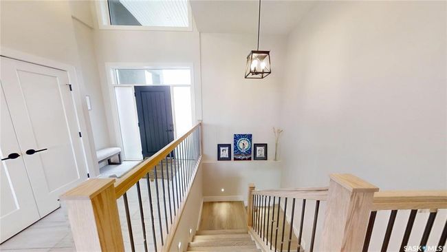 Stairs featuring a chandelier and baseboards | Image 22