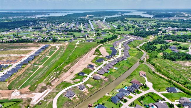 Panoramic shot of the Waterstone and Peninsula neighborhoods, just minutes from Lake Conroe. Enjoy quiet streets, thoughtfully designed communities, and nature right outside your door. | Image 50