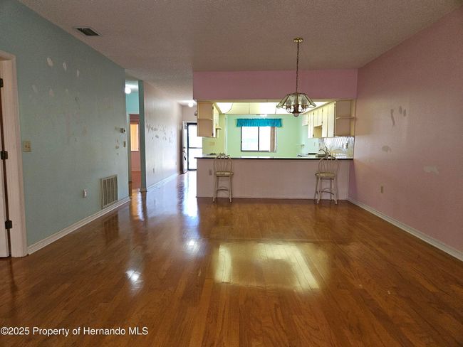 view from sliding doors to the enclosed lanai | Image 4