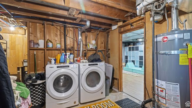 Laundry area featuring washing machine and dryer, gas water heater, and laundry area | Image 19