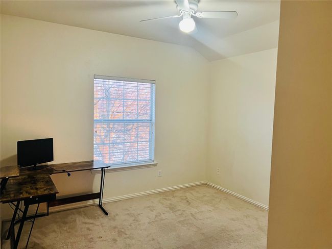 Bedroom with light carpet, vaulted ceiling, and ceiling fan | Image 20