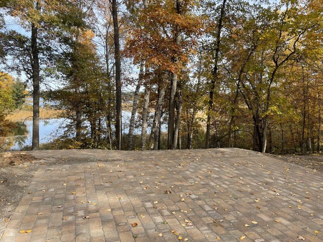 patio at lake side is complete, fire pit and furniture coming soon. | Image 9