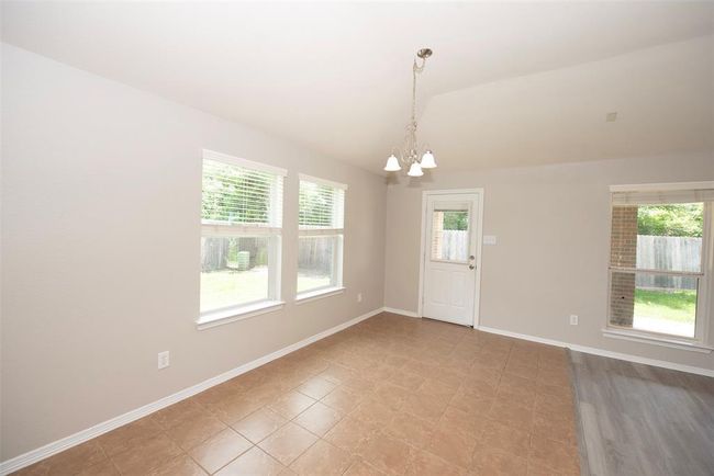 Wonderfully spacious dining area next to the kitchen and family room. | Image 14