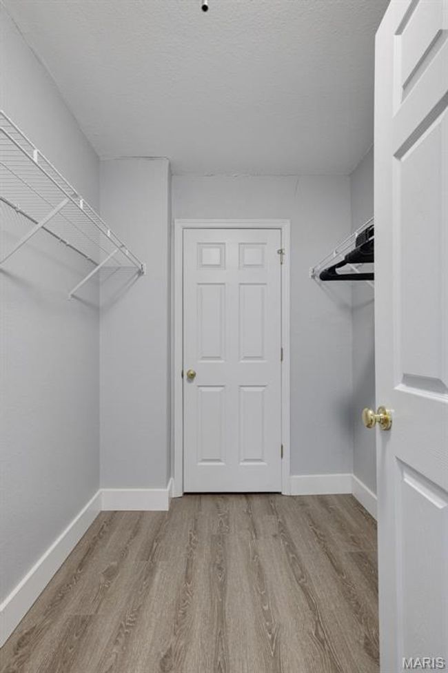 Primary Bedroom Walk-In Closet | Image 19