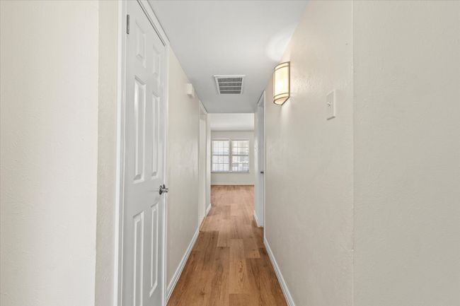 The entry way leads you into this light and bright condo with new Luxury Vinyl Plank flooring | Image 5