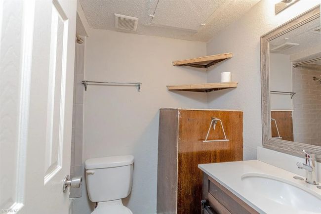 Bathroom with vanity and a textured ceiling | Image 9