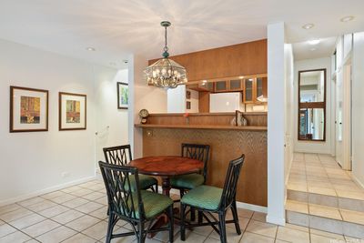 To the left of your dining area is the entrance, and to the right, is the hallway leading to the guest bathroom and bedrooms. The two Koa framed mirrors will convey with the property. | Image 3