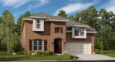 View of front facade featuring a garage and a front lawn | Image 1