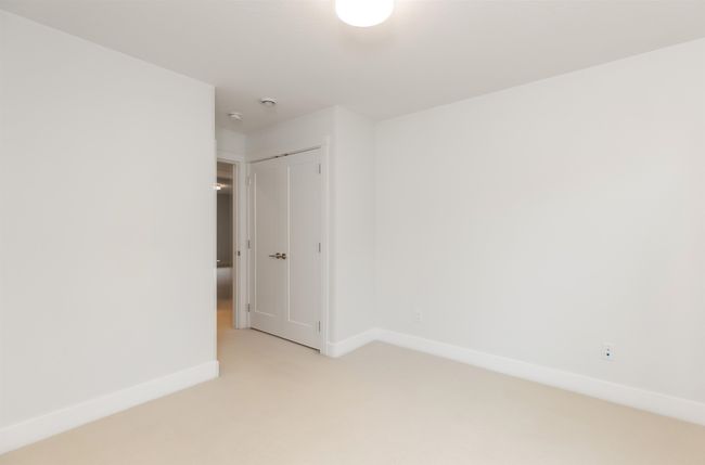 Spare room featuring baseboards and light colored carpet | Image 24