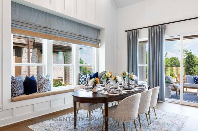 Dining room featuring dark wood finished floors and a decorative wall | Image 22