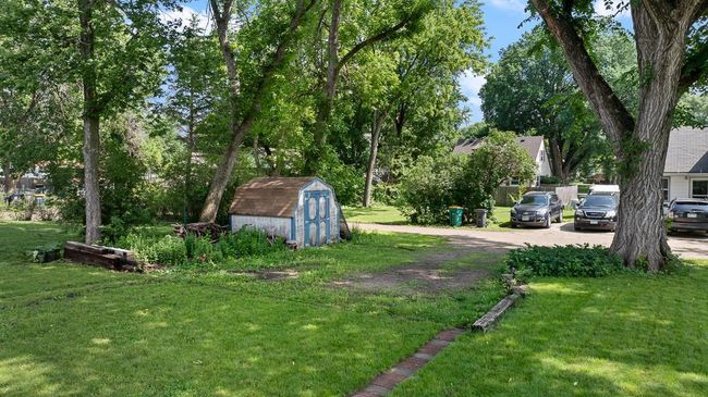 A driveway space designated for parking - accessible via alleyway | Image 12