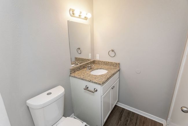 Carpeted empty room featuring a ceiling fan and healthy amount of natural light | Image 25