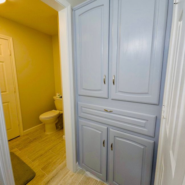 Bathroom with wood finished floors and toilet | Image 21