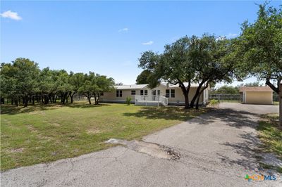 Long extended driveway with plenty of parking. | Image 3