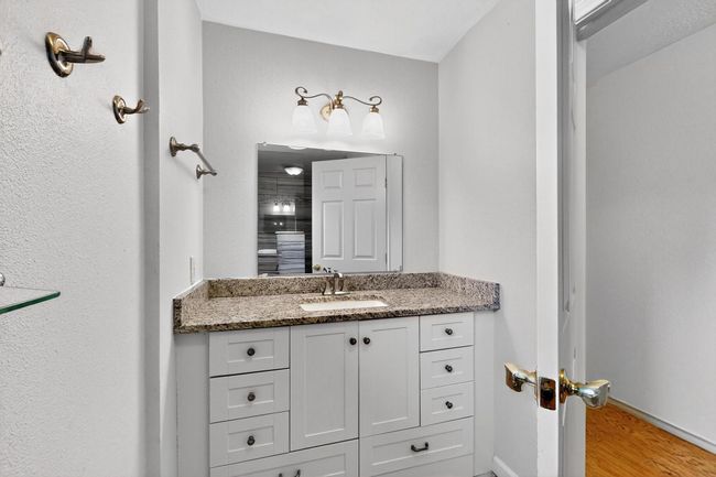 Bathroom featuring vanity and wood finished floors | Image 21