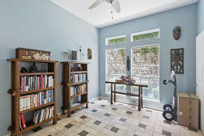 Sitting room with plenty of natural light and a ceiling fan | Image 7