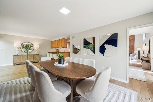 Dining room featuring baseboards, visible vents, and light wood-style floors | Image 22