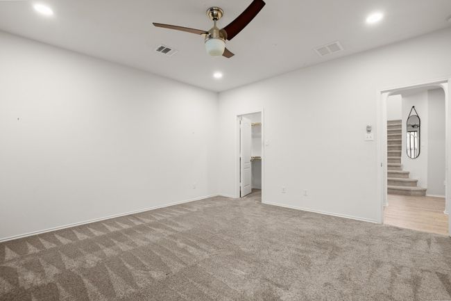 Unfurnished bedroom with visible vents, recessed lighting, and carpet floors | Image 13