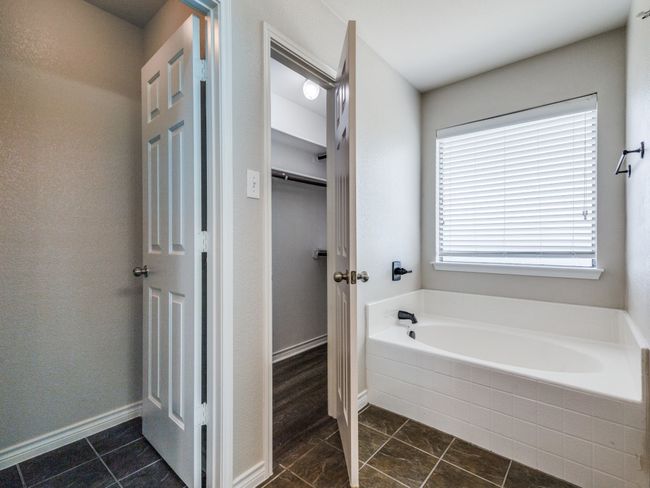 Primary bathroom with separate garden tub | Image 23