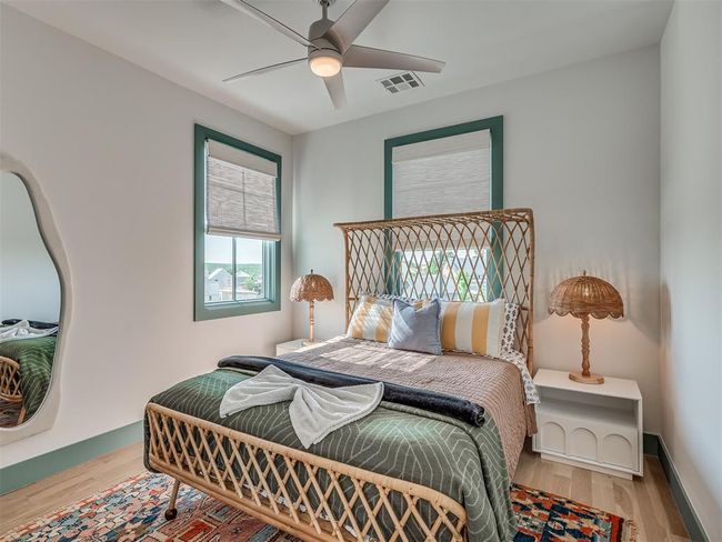 Bedroom with wood finished floors and a ceiling fan | Image 30