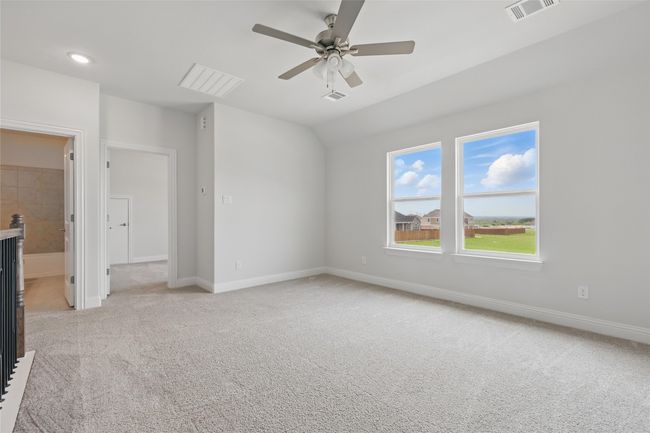 Unfurnished bedroom with baseboards, light colored carpet, and visible vents | Image 25