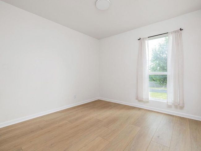 Unfurnished room with light wood-style flooring and baseboards | Image 18