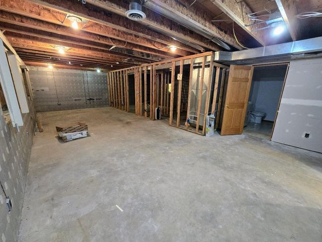 Family room view of door to bedroom, storeroom, & bath | Image 37