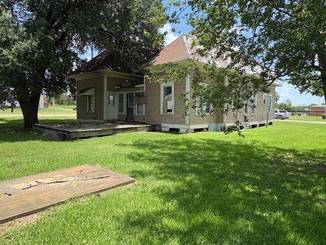 Rear view of property featuring a lawn | Image 12