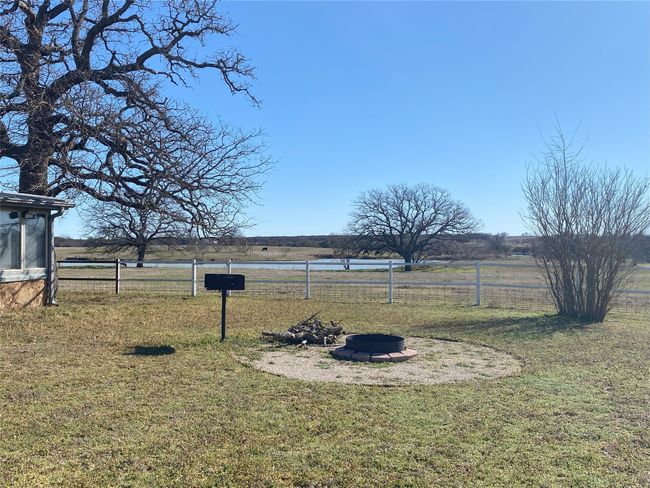 View of yard with an outdoor fire pit and BBQ | Image 21
