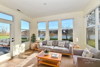 Panoramic views of this gorgeous, private lake from your bright and airy sunrrom. This picture was virtually staged. | Image 3