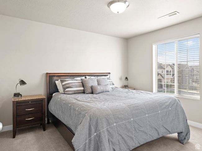 Carpeted bedroom with baseboards | Image 21