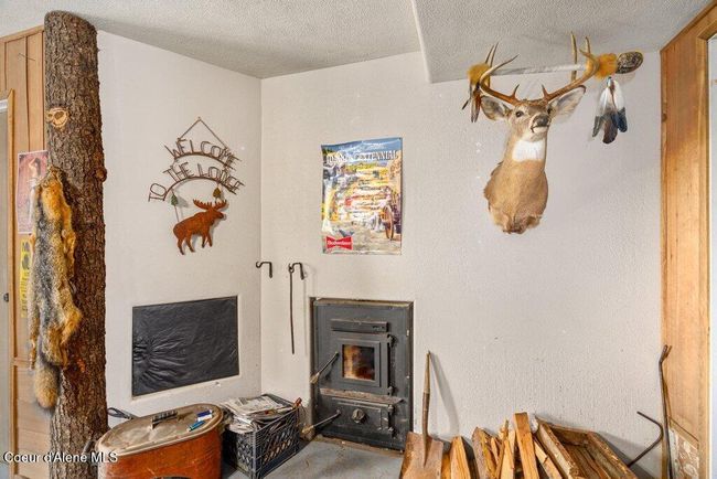 Unique auxiliary wood heat plumbed into the propane furnace to help offset propane costs. | Image 27