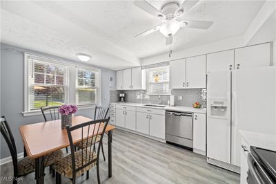 White Cabinetry With Gorgeous Quartz Marble Looking Countertops | Image 2