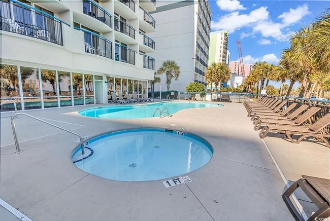 Community pool featuring a community hot tub and a patio area | Image 22