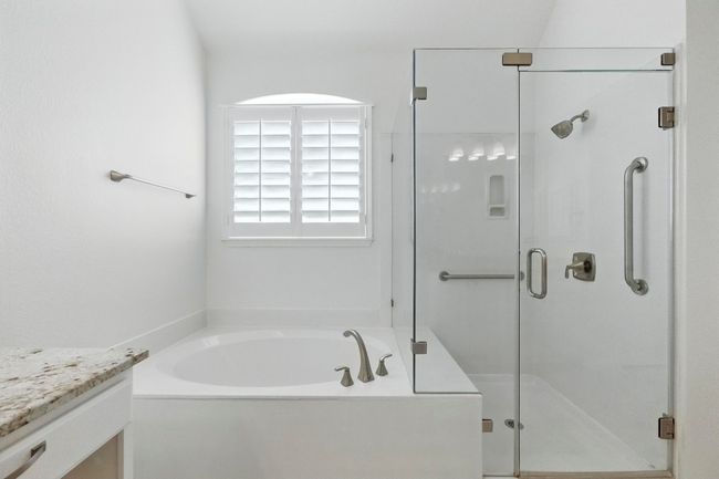 Natural light, soaking tub and walk-in shower. | Image 22