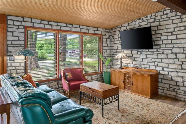 Living room with wood ceiling, wood finished floors, and lofted ceiling | Image 7