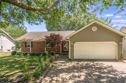 215 Darrowby Dr, Raymore, MO, 64083-9182 | Card Image