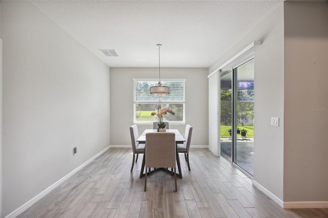 Dining Room overlooks beautiful manicured backyard | Image 14