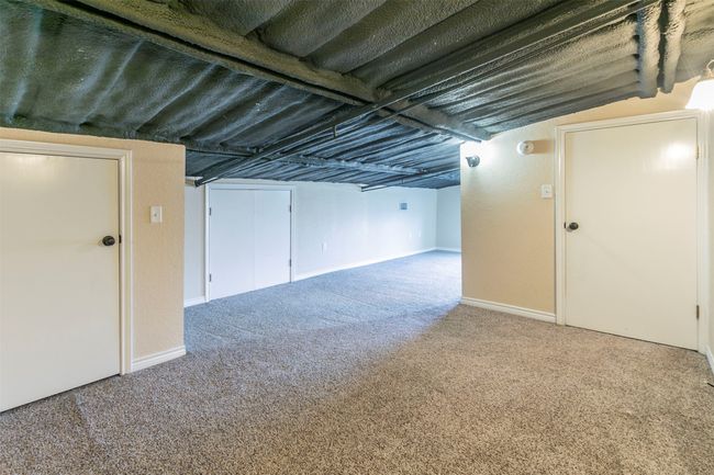 Finished below grade area featuring carpet and baseboards | Image 20