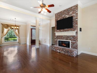 Dining room flows into foyer and living room. | Image 3