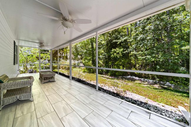 Sunroom / solarium featuring ceiling fan | Image 31