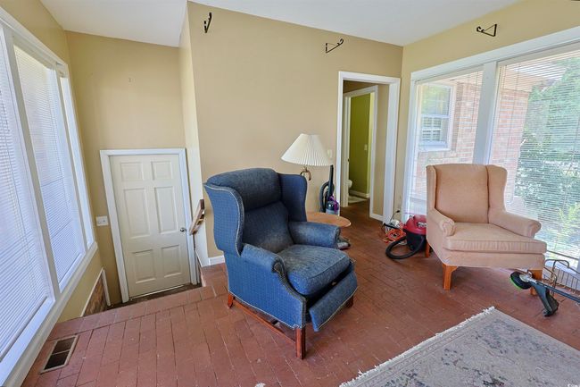 Living area featuring healthy amount of natural light and hardwood / wood-style floors | Image 18