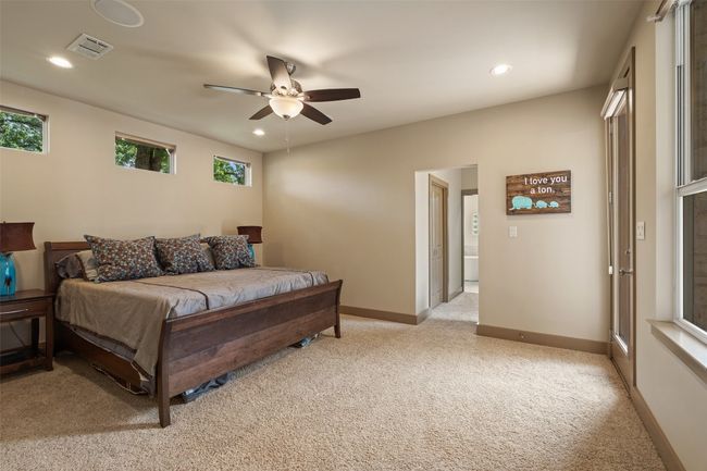 Bedroom with light carpet, multiple windows, recessed lighting, a ceiling fan, and baseboards | Image 18