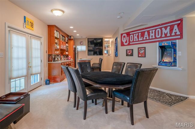 Dining space with light carpet, recessed lighting, and french doors | Image 41