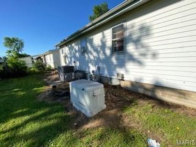 View of side of home featuring a yard | Image 10