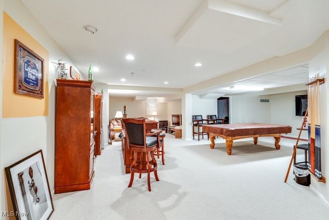 Playroom featuring light colored carpet, recessed lighting, and billiards table | Image 33