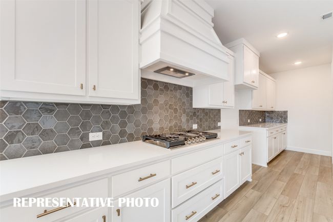 Thoughtful design elements paired with beautiful finishes create this dream kitchen that any chef would love! REPRESENTATIVE PHOTO | Image 6