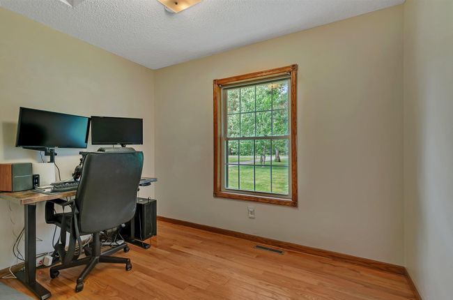 3rd main floor bedroom being used as an office | Image 21