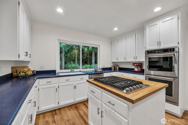 Cooks dream kitchen with center cooking island has plenty of counter and storage space | Image 9